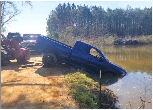 Woman Swims to Safety  As Truck Plunges into Pond