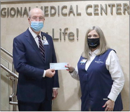 Meadows Health Auxiliary  Presents Check for New 3D  Mammography Machine