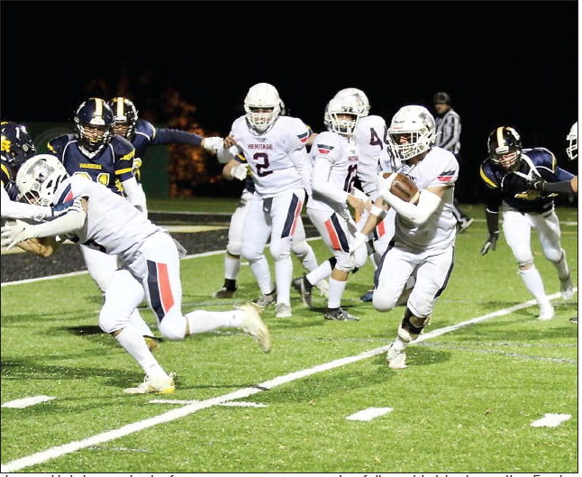 VHA quarterback Josiah Smith takes ....